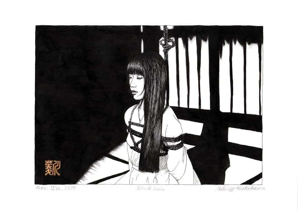 Woman with black hair tied behind